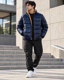 PARVANO puffer jacket in navy blue with contrast lining — full front styling view